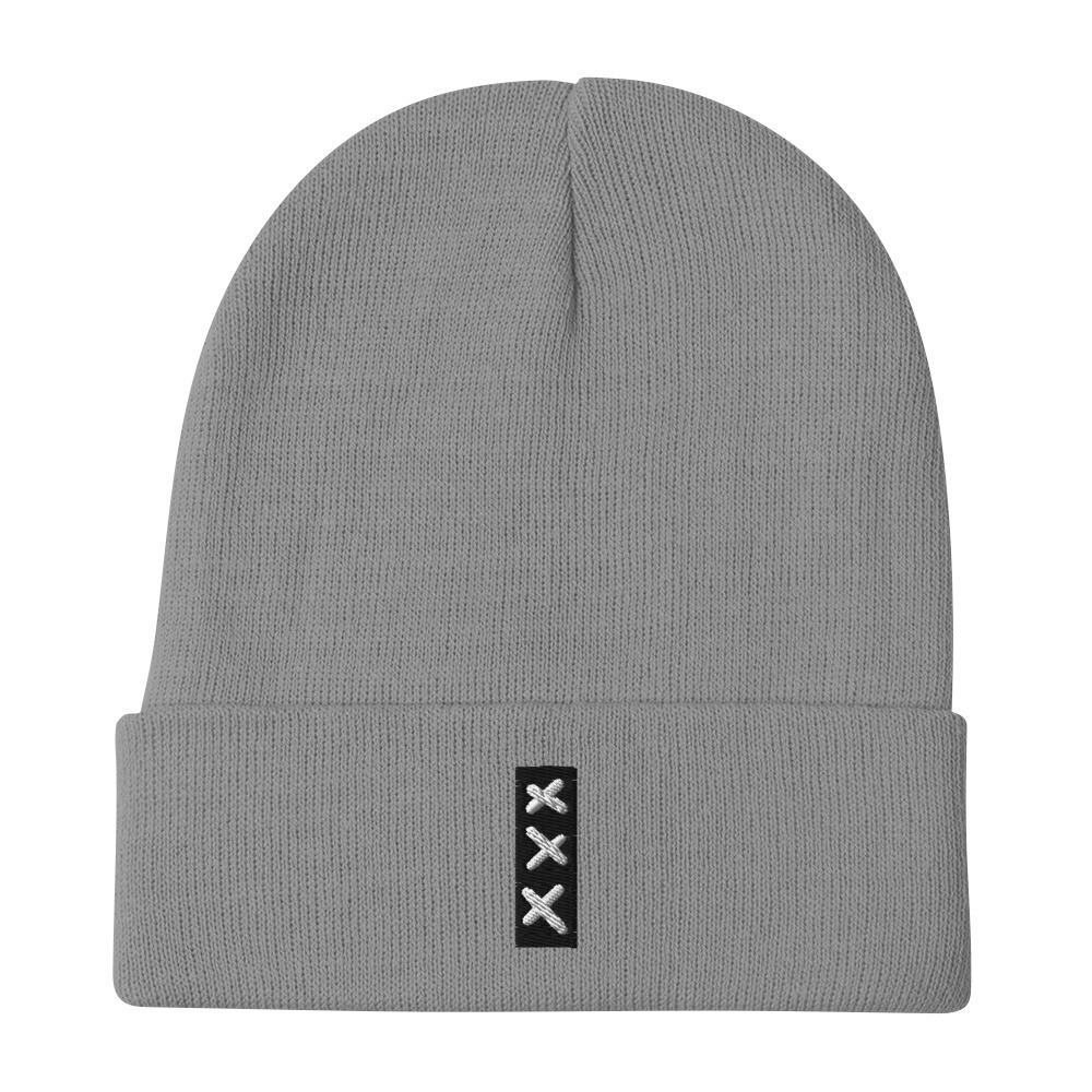 Introducing the SUBTLE & MIGHTY XXX (3 Amsterdam Crosses) embroidered Beanie—a gray knit beanie with a folded brim, adorned on the front with a small black patch showcasing three vertically arranged white Xs, subtly inspired by the iconic Amsterdam Crosses. This beanie captures a SUBTLE & MIGHTY vibe, making it an effortless addition to any outfit. Introducing the SUBTLE & MIGHTY XXX (3 Amsterdam Crosses) embroidered Beanie—a gray knit beanie with a folded brim, adorned on the front with a small black patch showcasing three vertically arranged white Xs, subtly inspired by the iconic Amsterdam Crosses. This beanie captures a SUBTLE & MIGHTY vibe, making it an effortless addition to any outfit.