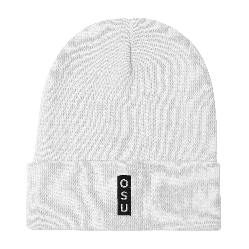 The Subtle & Mighty OSU Embroidered Beanie is a white knit hat with a folded brim, featuring a black vertical patch embroidered with the letters “OSU” in white.
