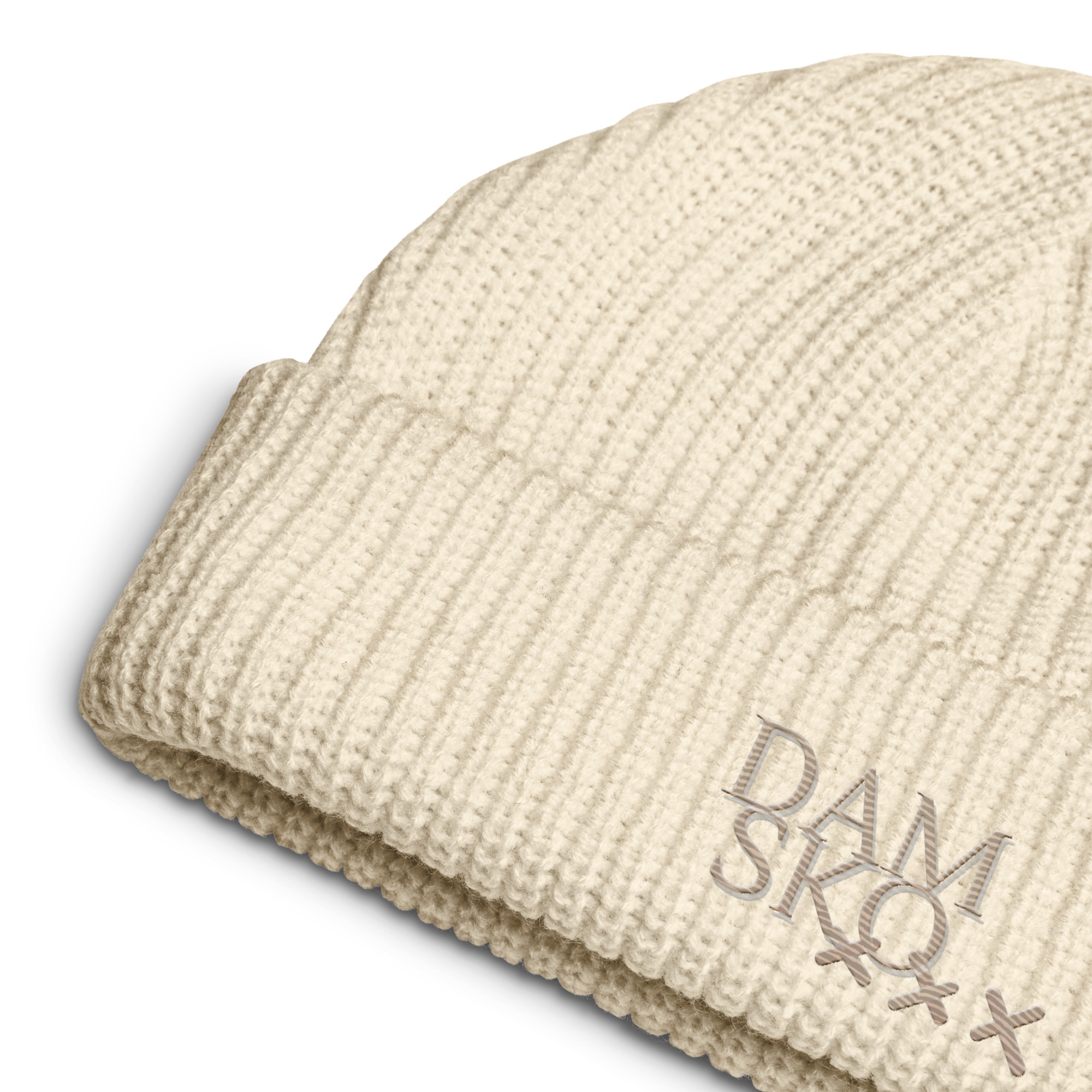 A close-up of the 3-crosses AMSTERDAMSKO embroidered FISHERMAN Beanie in cream, featuring DAM SKQ and three light gray Xs stitched on the folded brim, highlights the distinctive and stylish AMSTERDAMSKO design of this knitted accessory. A close-up of the 3-crosses AMSTERDAMSKO embroidered FISHERMAN Beanie in cream, featuring DAM SKQ and three light gray Xs stitched on the folded brim, highlights the distinctive and stylish AMSTERDAMSKO design of this knitted accessory.