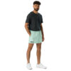 A man with short curly hair and a beard stands against a white background wearing MJL Athletic Shorts, a dark gray t-shirt, and white sneakers, highlighting comfortable sportswear ideal for casual outings. A man with short curly hair and a beard stands against a white background wearing MJL Athletic Shorts, a dark gray t-shirt, and white sneakers, highlighting comfortable sportswear ideal for casual outings.